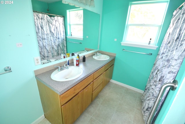 bathroom featuring vanity, tile patterned flooring, and curtained shower