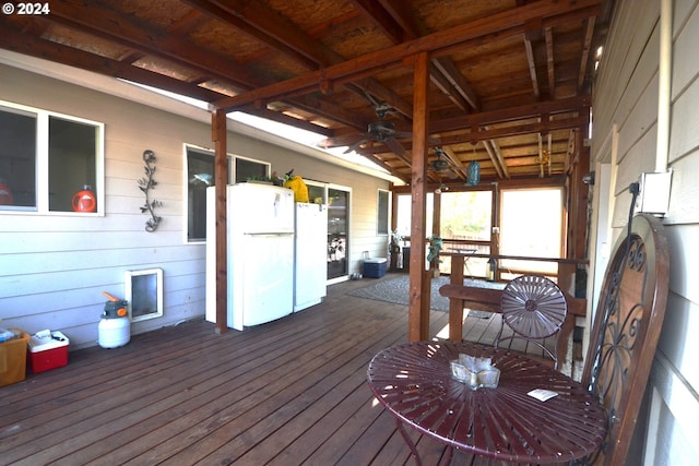 wooden deck featuring ceiling fan