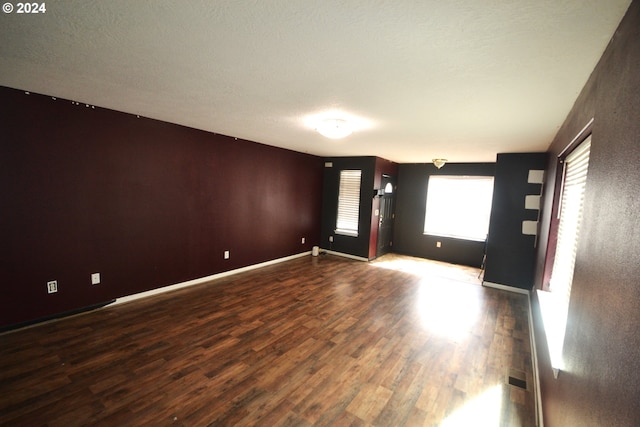 empty room featuring dark hardwood / wood-style floors