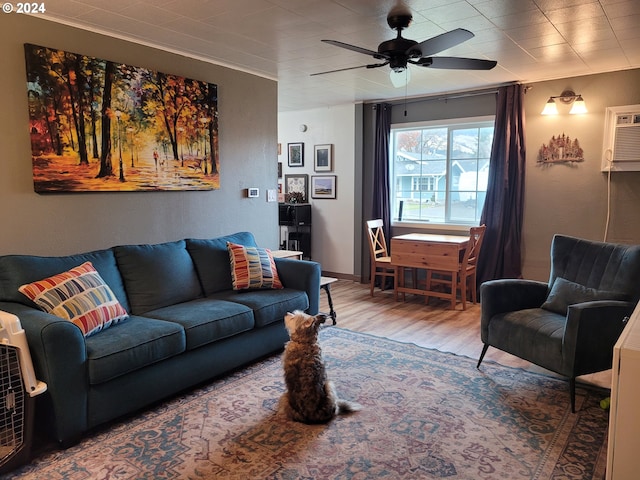 living room featuring hardwood / wood-style flooring, an AC wall unit, and ceiling fan