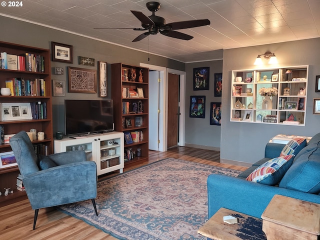 living room featuring ceiling fan and hardwood / wood-style flooring