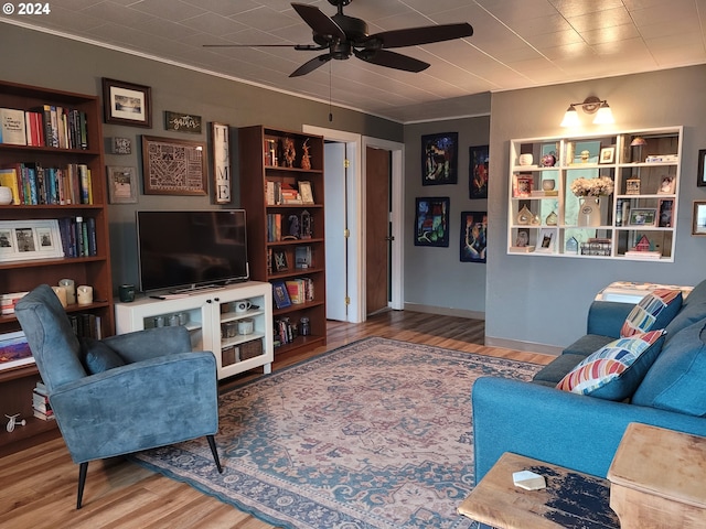 living room featuring hardwood / wood-style flooring and ceiling fan