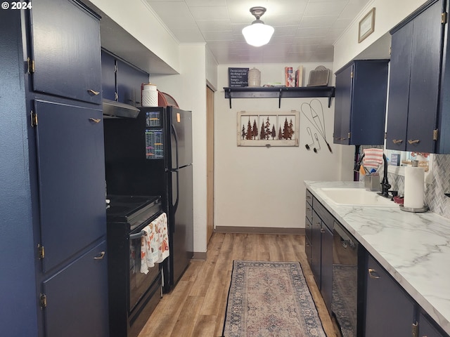 kitchen with black appliances, light hardwood / wood-style floors, blue cabinets, and sink