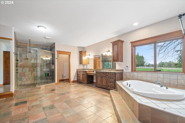 bathroom featuring vanity and plus walk in shower