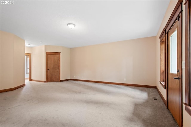 spare room with light carpet