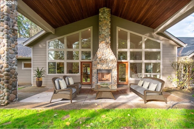 view of patio featuring an outdoor living space with a fireplace