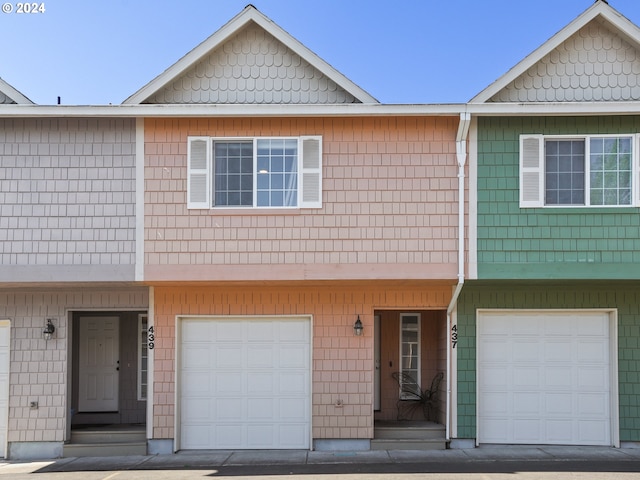 townhome / multi-family property featuring a garage