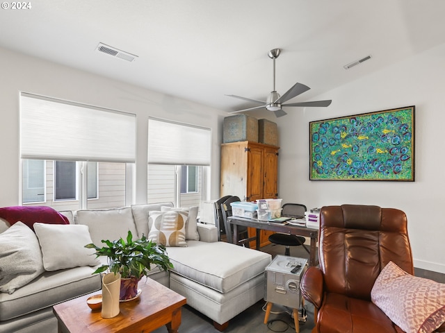 living room featuring ceiling fan and lofted ceiling