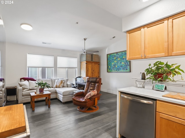 kitchen with light brown cabinetry, stainless steel dishwasher, ceiling fan, and dark wood-type flooring