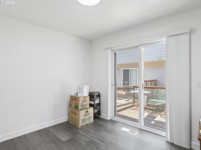 spare room with dark wood-type flooring