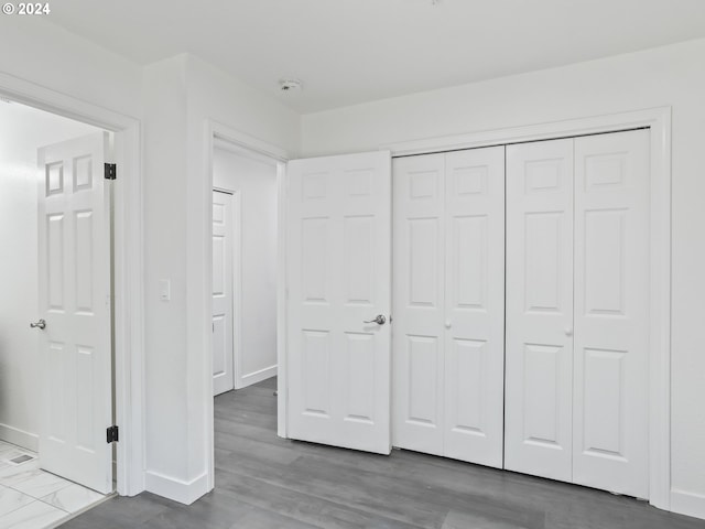 unfurnished bedroom with a closet