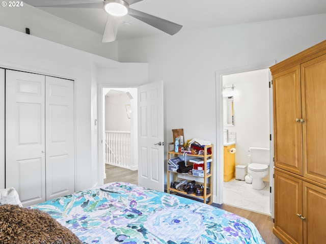 bedroom with dark hardwood / wood-style flooring, a closet, ceiling fan, and ensuite bathroom