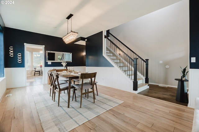 dining space with light wood-type flooring