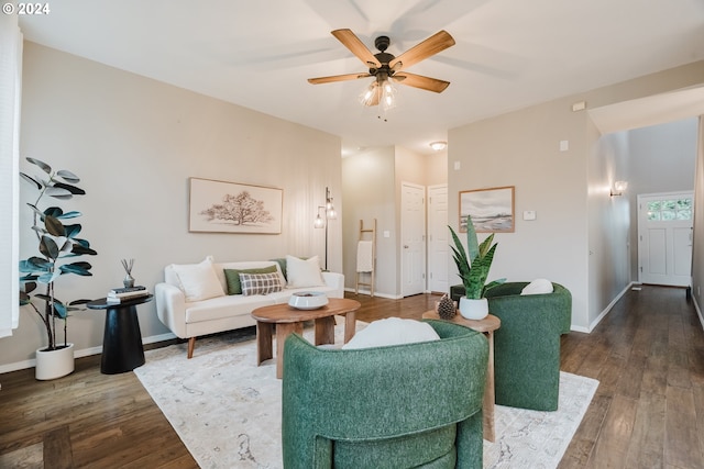 living room featuring dark hardwood / wood-style flooring and ceiling fan