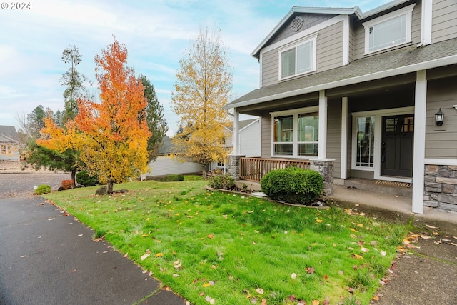 view of yard with covered porch