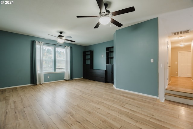 empty room featuring ceiling fan and light hardwood / wood-style floors