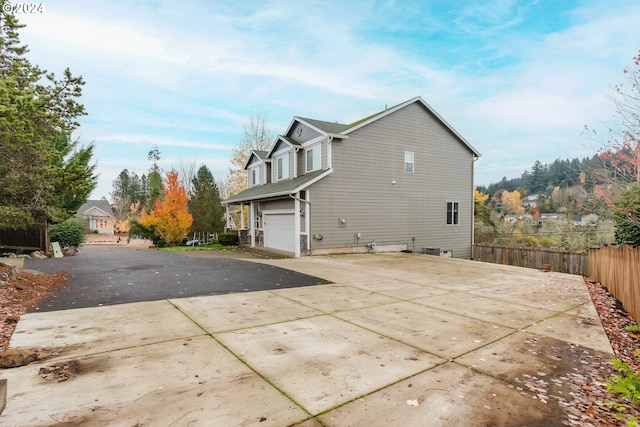 view of home's exterior with a garage