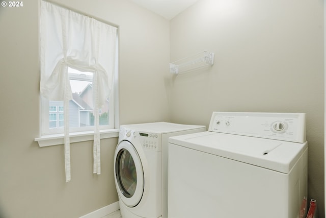 laundry area with independent washer and dryer