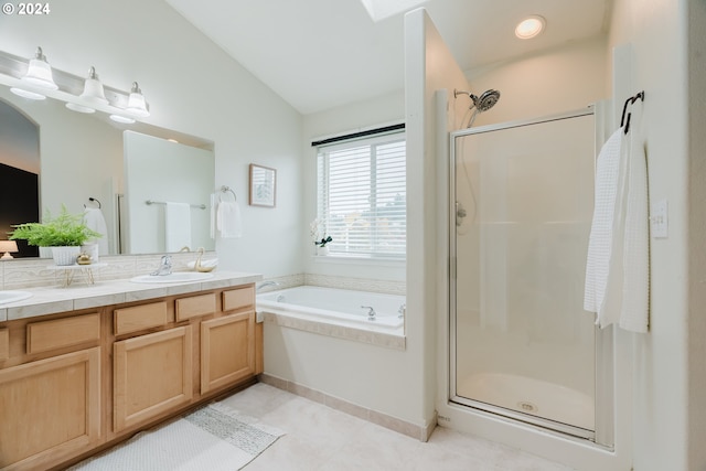 bathroom featuring tile patterned floors, vanity, plus walk in shower, and vaulted ceiling