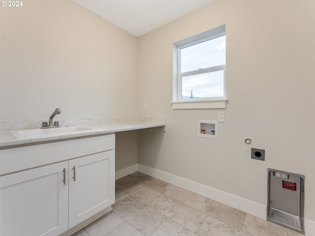 washroom featuring washer hookup, electric dryer hookup, sink, and cabinets