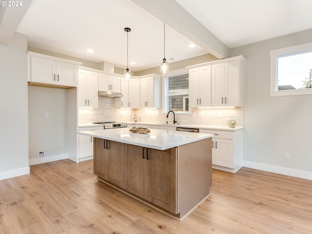 kitchen featuring white cabinets, light wood-type flooring, a kitchen island, and stainless steel electric stove