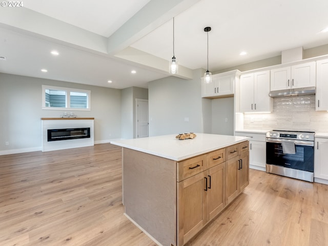 kitchen with light hardwood / wood-style floors, white cabinetry, stainless steel range with electric stovetop, hanging light fixtures, and a kitchen island