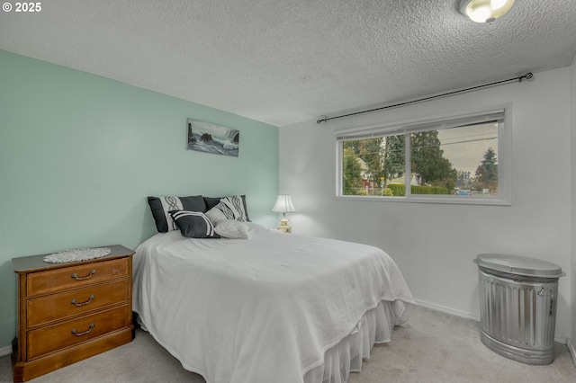 carpeted bedroom featuring a textured ceiling