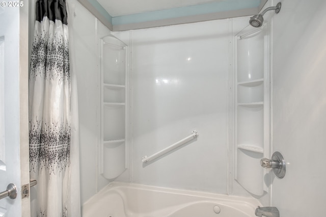 bathroom with shower / bathtub combination with curtain