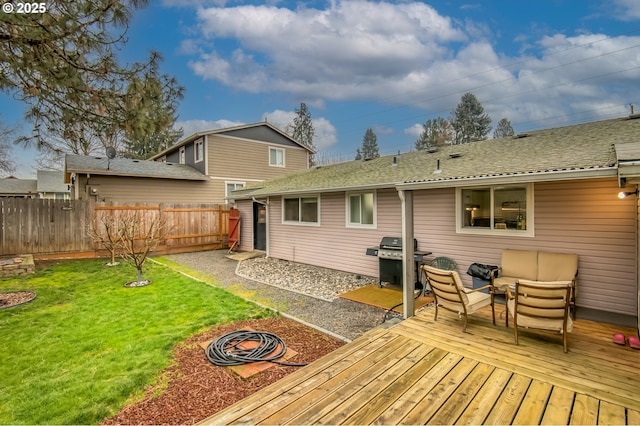 back of property with an outdoor living space, a shingled roof, fence, a lawn, and a deck