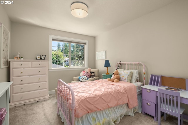 bedroom featuring light carpet