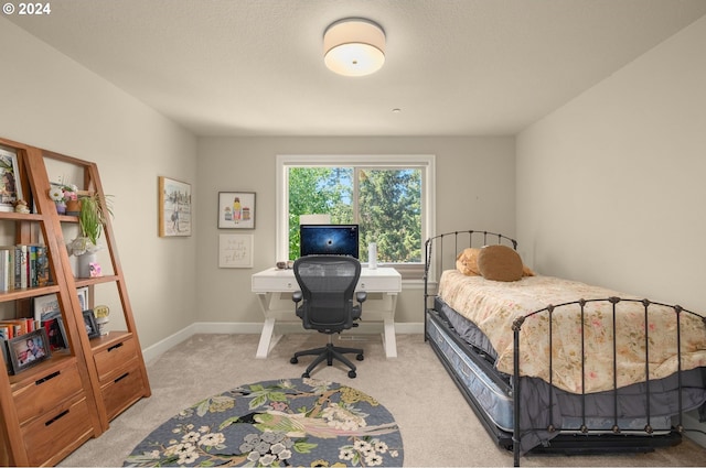 carpeted bedroom with a textured ceiling