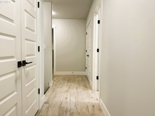 hallway featuring light hardwood / wood-style flooring