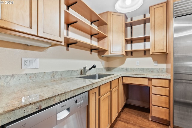 kitchen with light brown cabinetry, sink, wood-type flooring, and appliances with stainless steel finishes