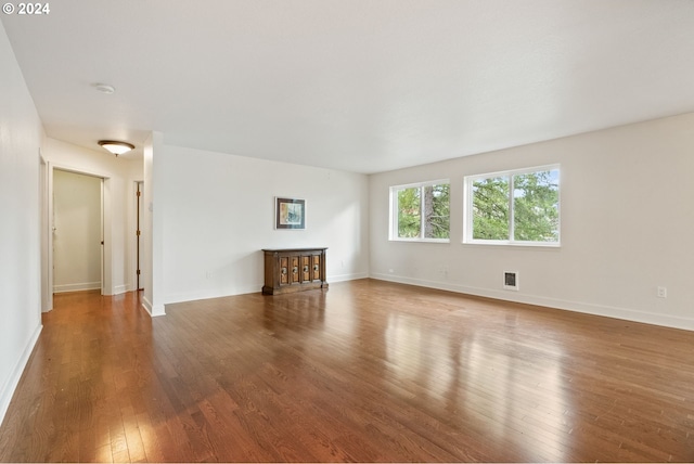 unfurnished living room with hardwood / wood-style flooring