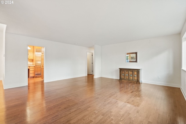 unfurnished living room with light hardwood / wood-style floors