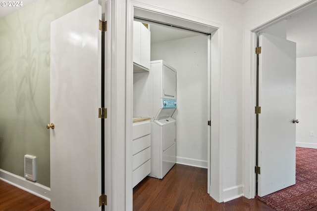 closet with stacked washing maching and dryer