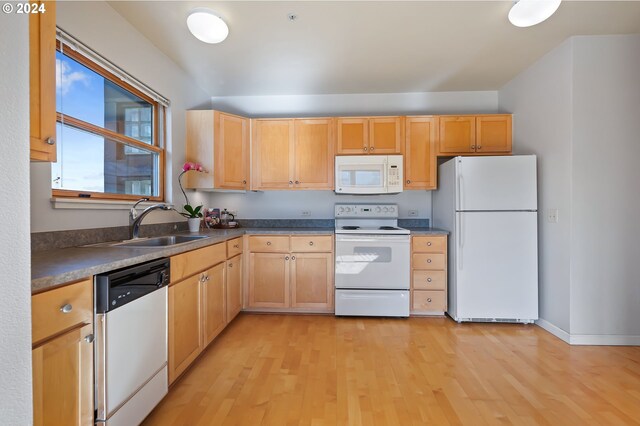 1134 SW Jefferson St Unit 609, Portland, OR 97201 - kitchen with light brown cabinetry, white appliances, sink, and light wood-type flooring