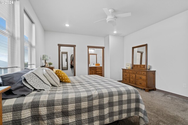 bedroom with ensuite bath, ceiling fan, and carpet