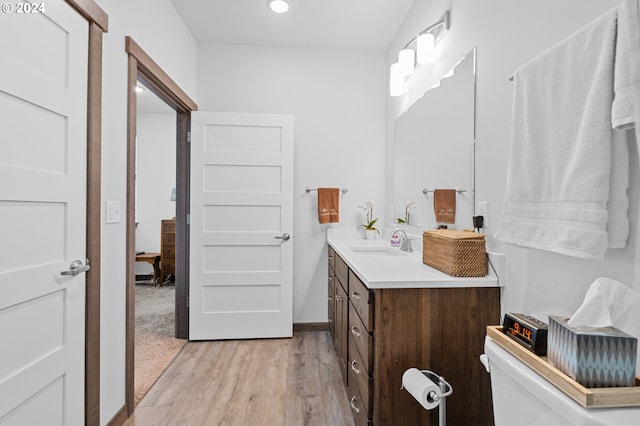 bathroom with wood-type flooring and vanity