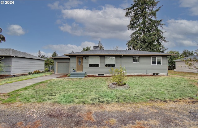 single story home with a front yard and a garage