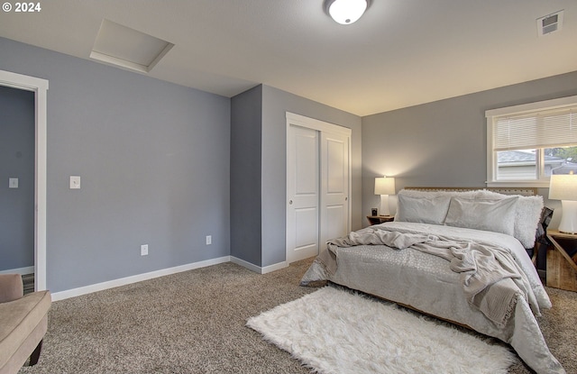 carpeted bedroom featuring a closet