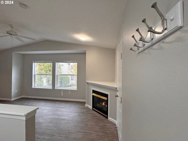 unfurnished living room featuring lofted ceiling and ceiling fan