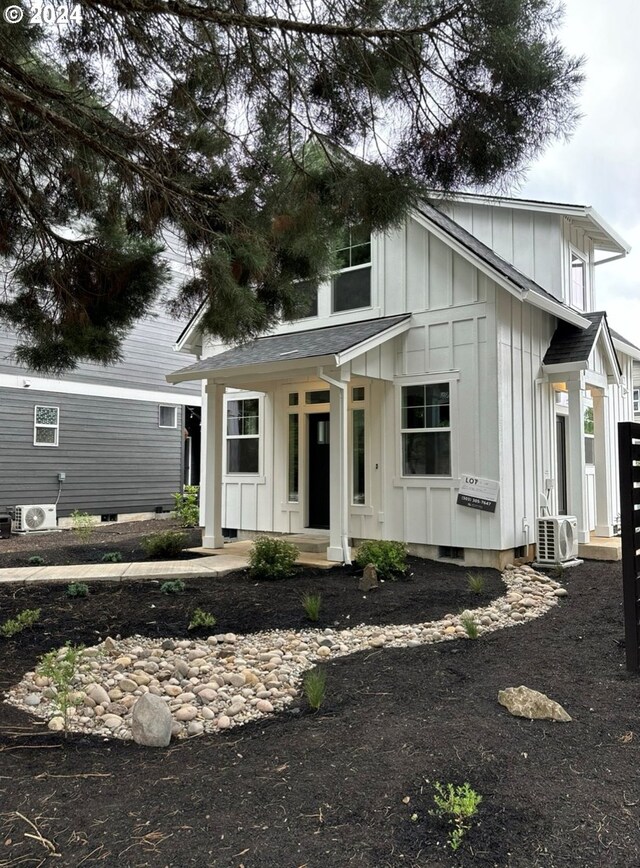 modern inspired farmhouse featuring central air condition unit