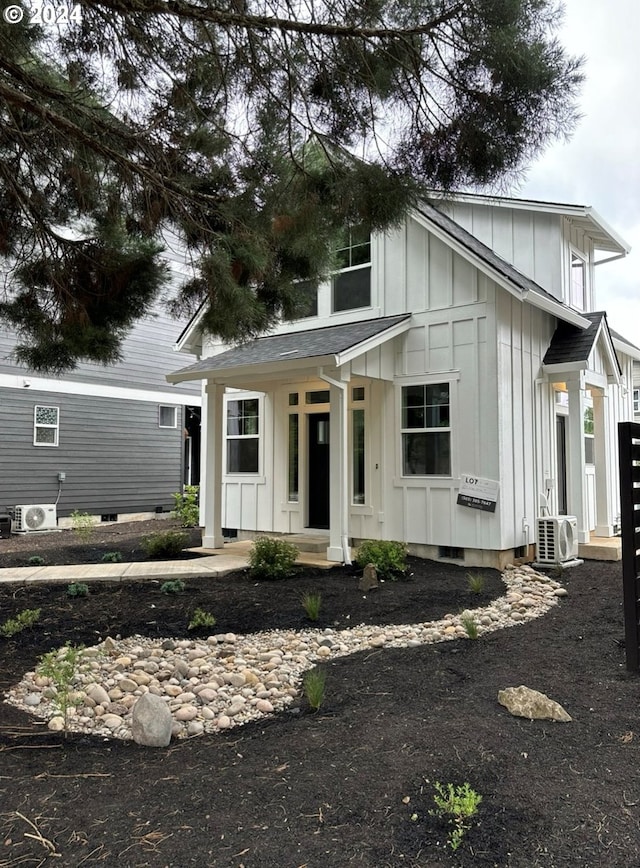 view of front of property with ac unit