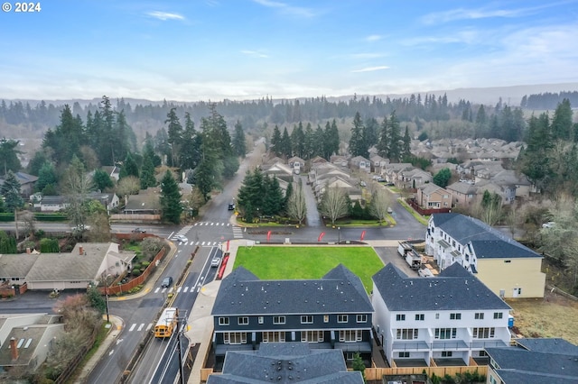 birds eye view of property with a residential view