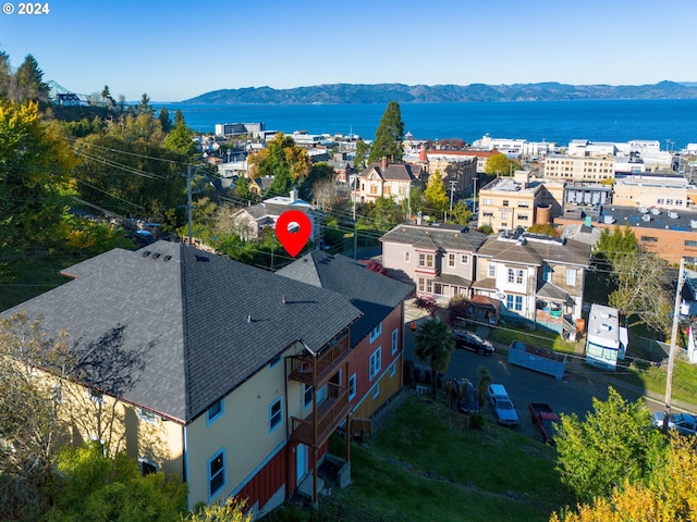 birds eye view of property featuring a water and mountain view