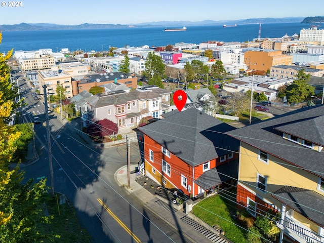 aerial view featuring a water and mountain view