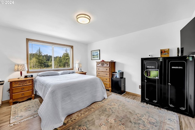 bedroom with light hardwood / wood-style floors