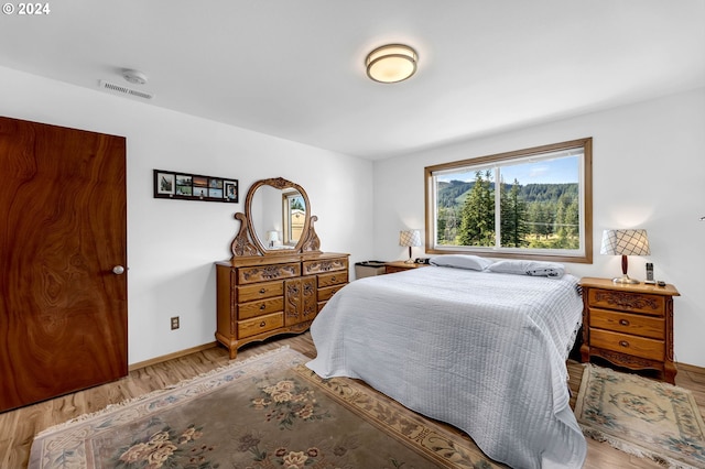 bedroom featuring wood-type flooring