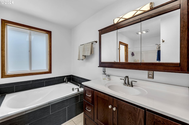 bathroom with separate shower and tub, tile patterned floors, and vanity